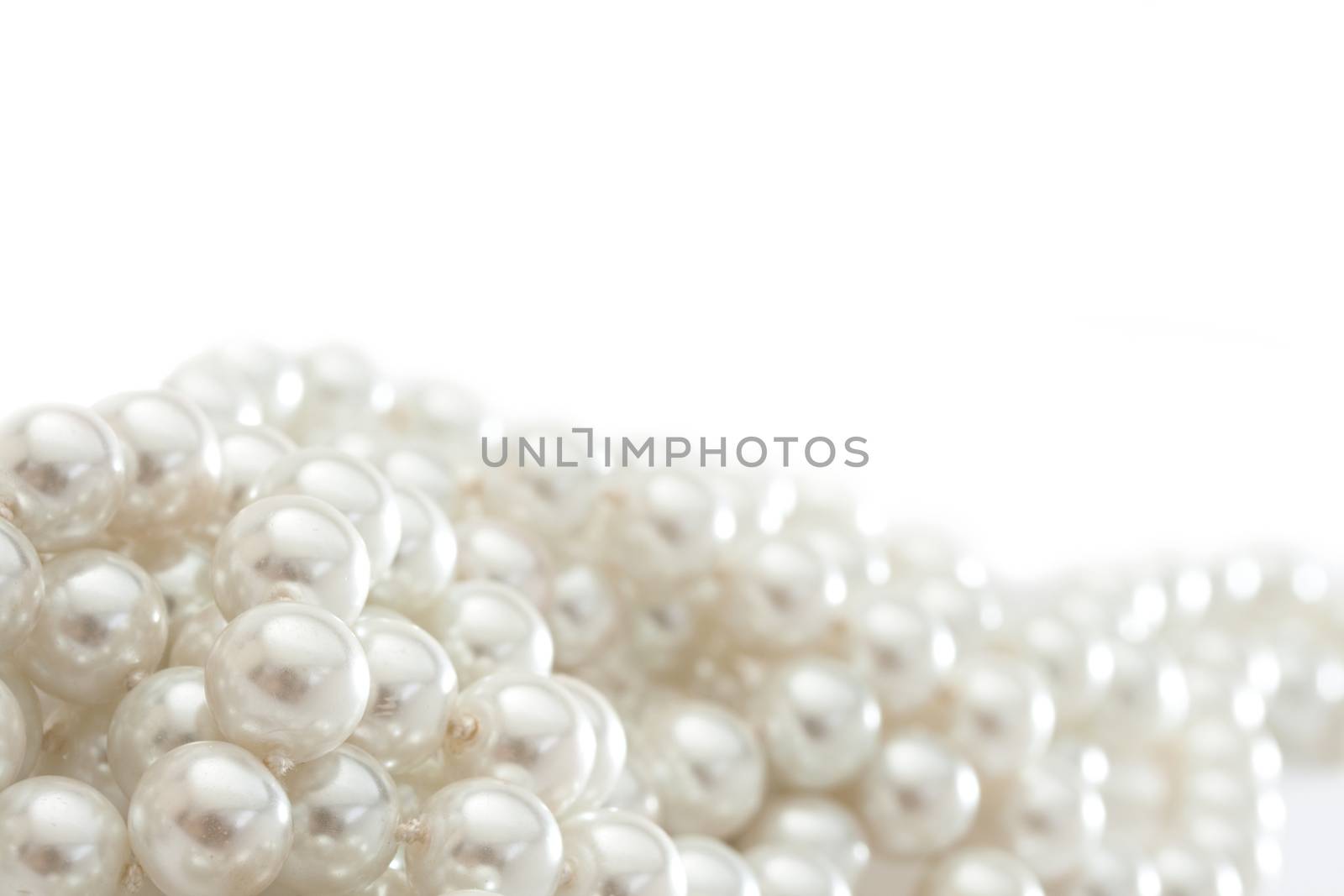 String of pearls on white by Garsya