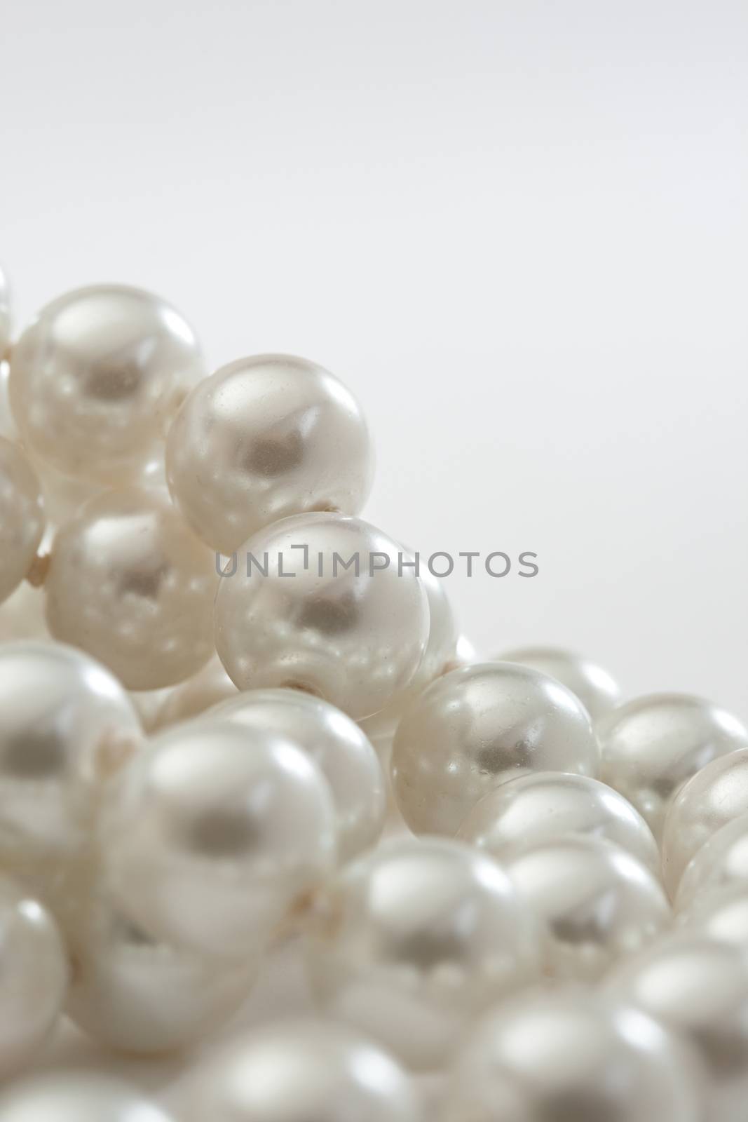 String of pearls on white by Garsya
