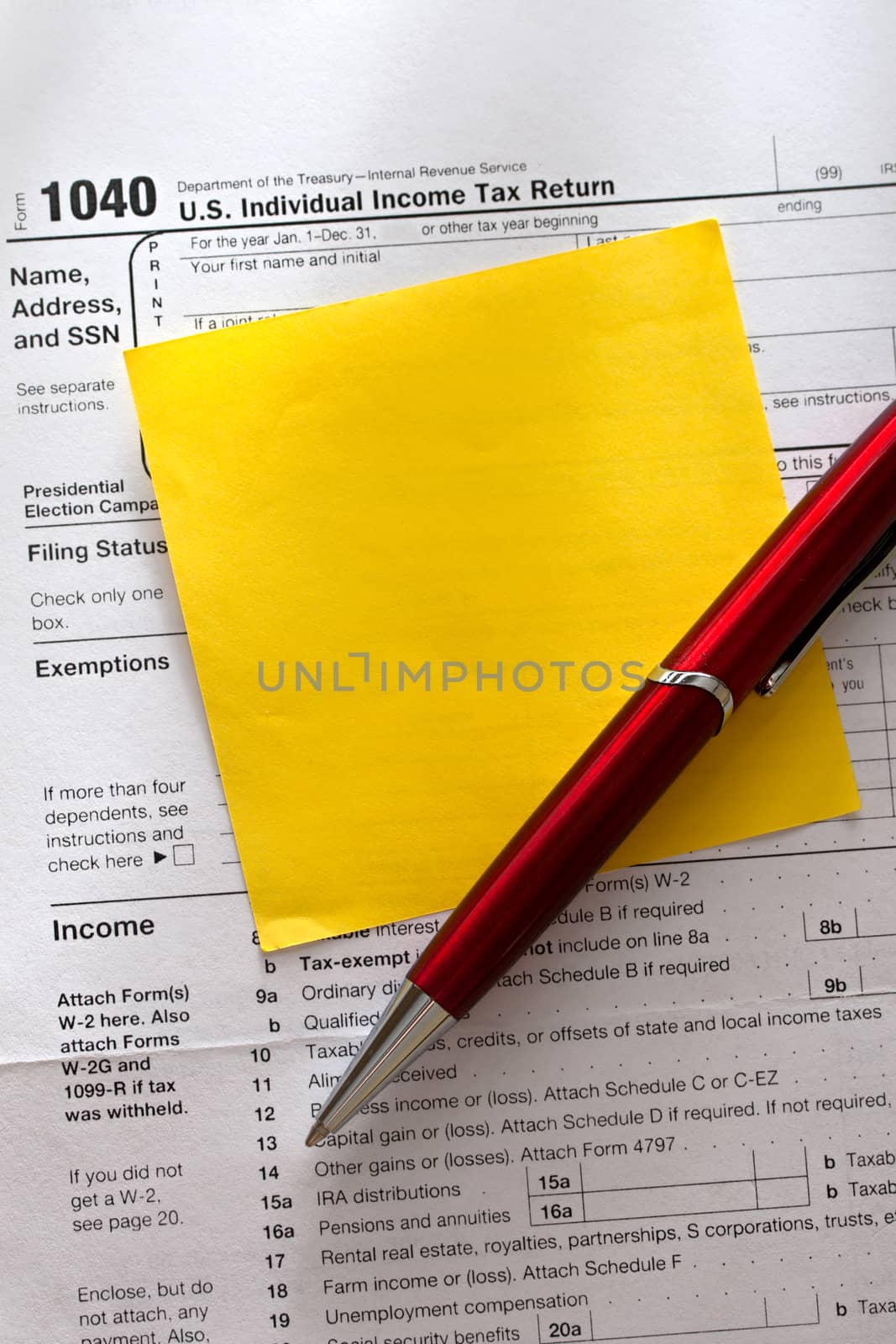 Tax form, red pen and sticker