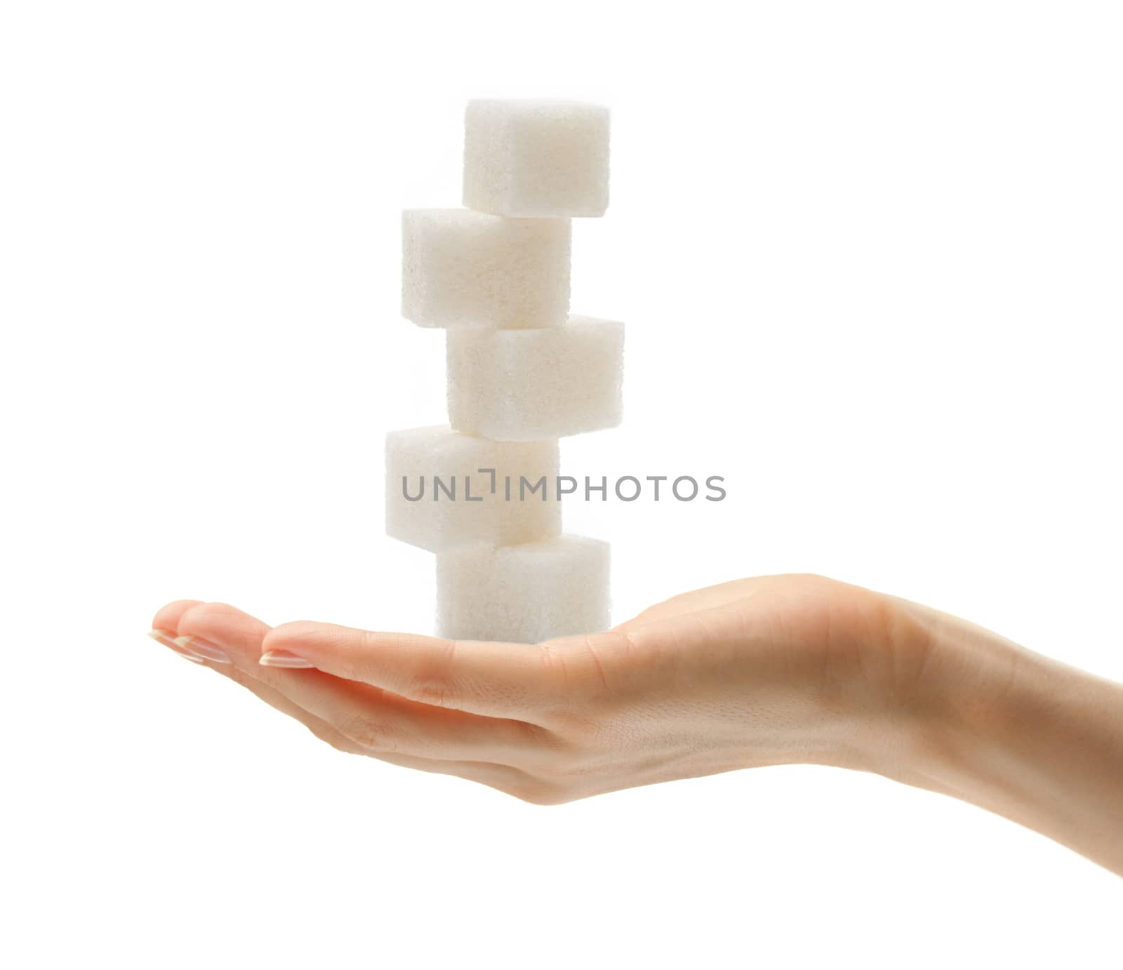 Female hand with sugar cubes 