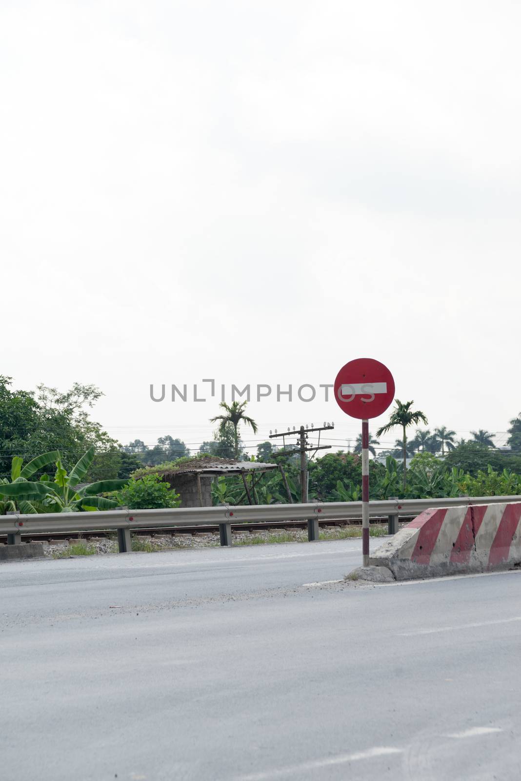 Traffic stop signs on the road to let driver beware of the barrier