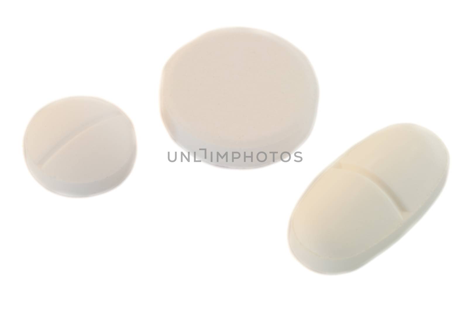 three beautiful isolated medicine pill in white background