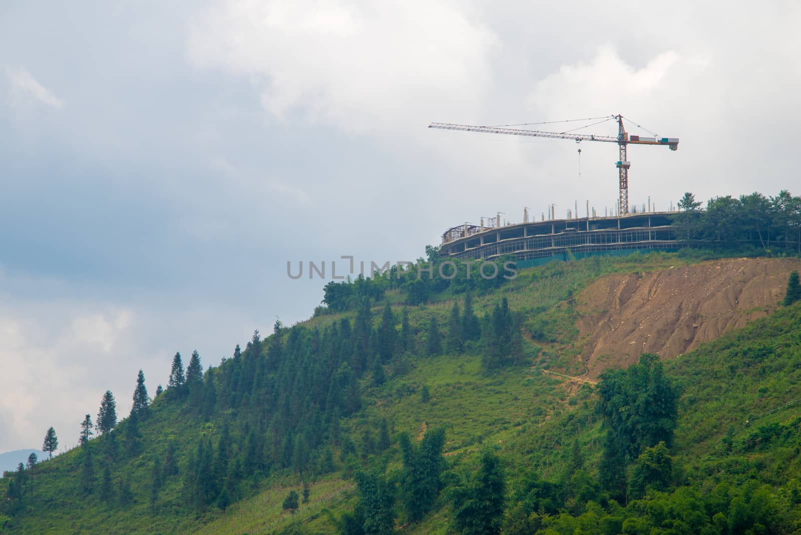 Construction crane building on hilltop that have beautiful view