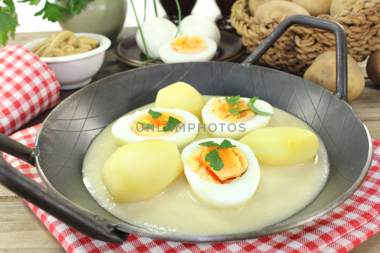 a pan with mustard eggs and potatoes