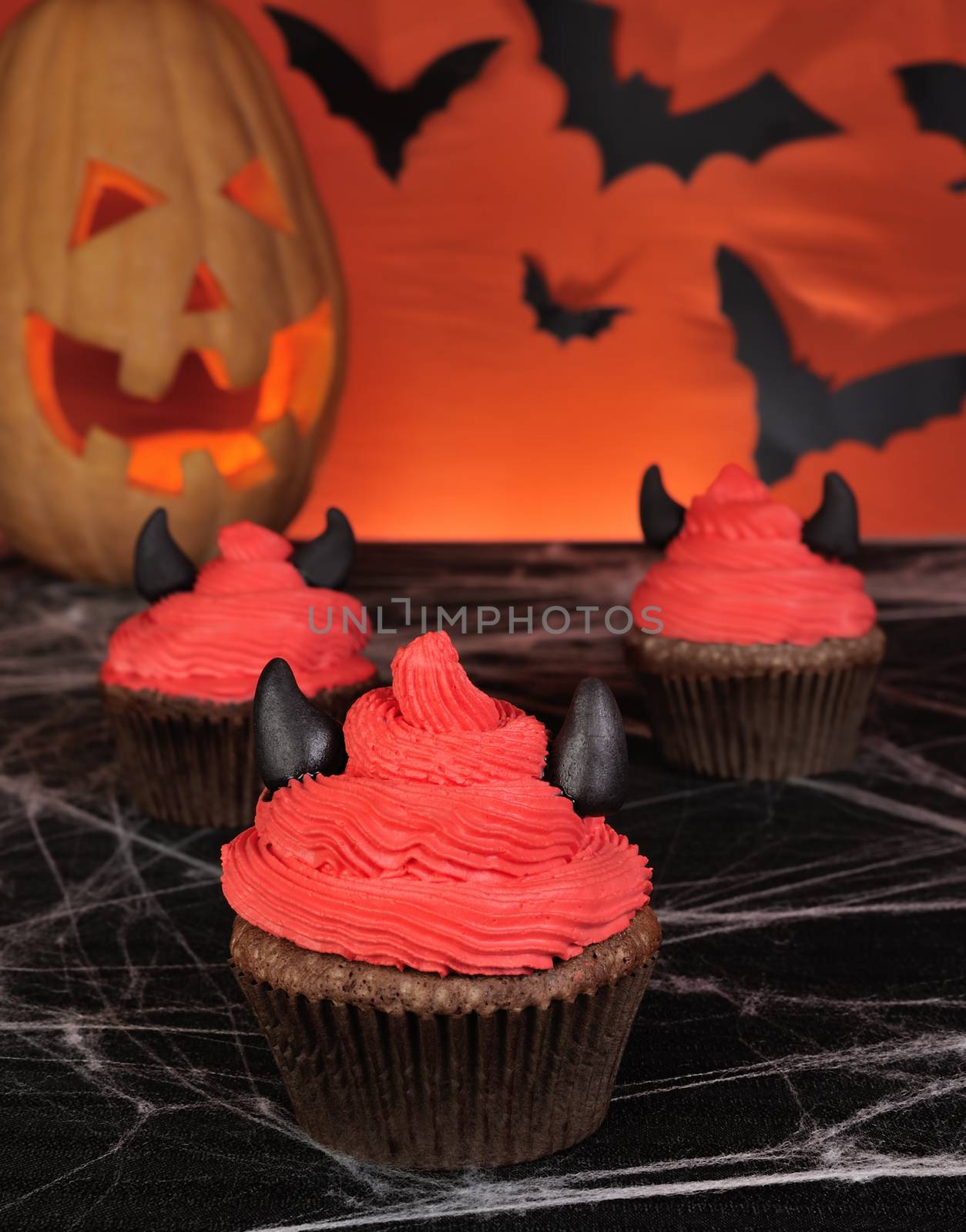 Muffins with cream and marzipan horns feature