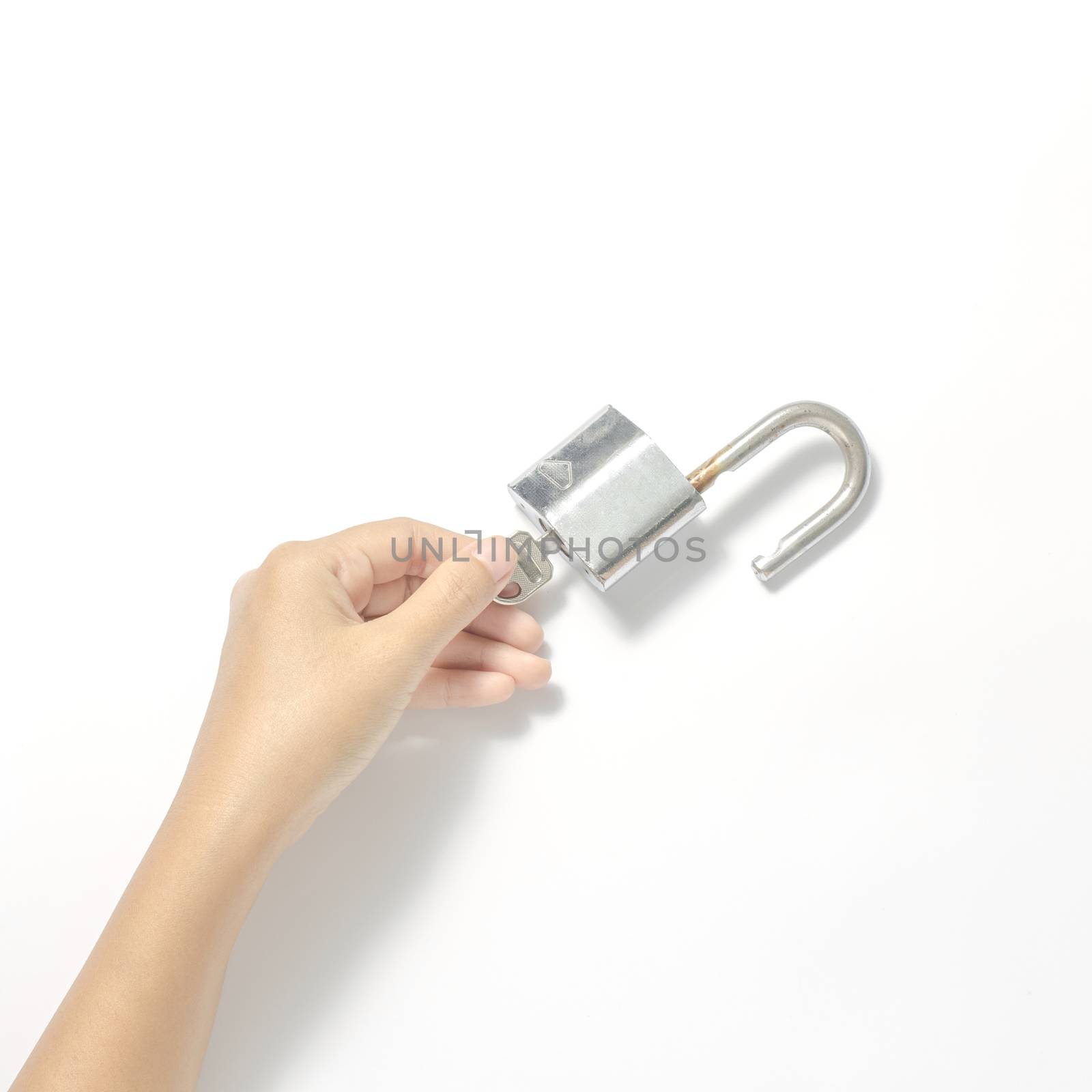 woman hand open padlock with key on a white background