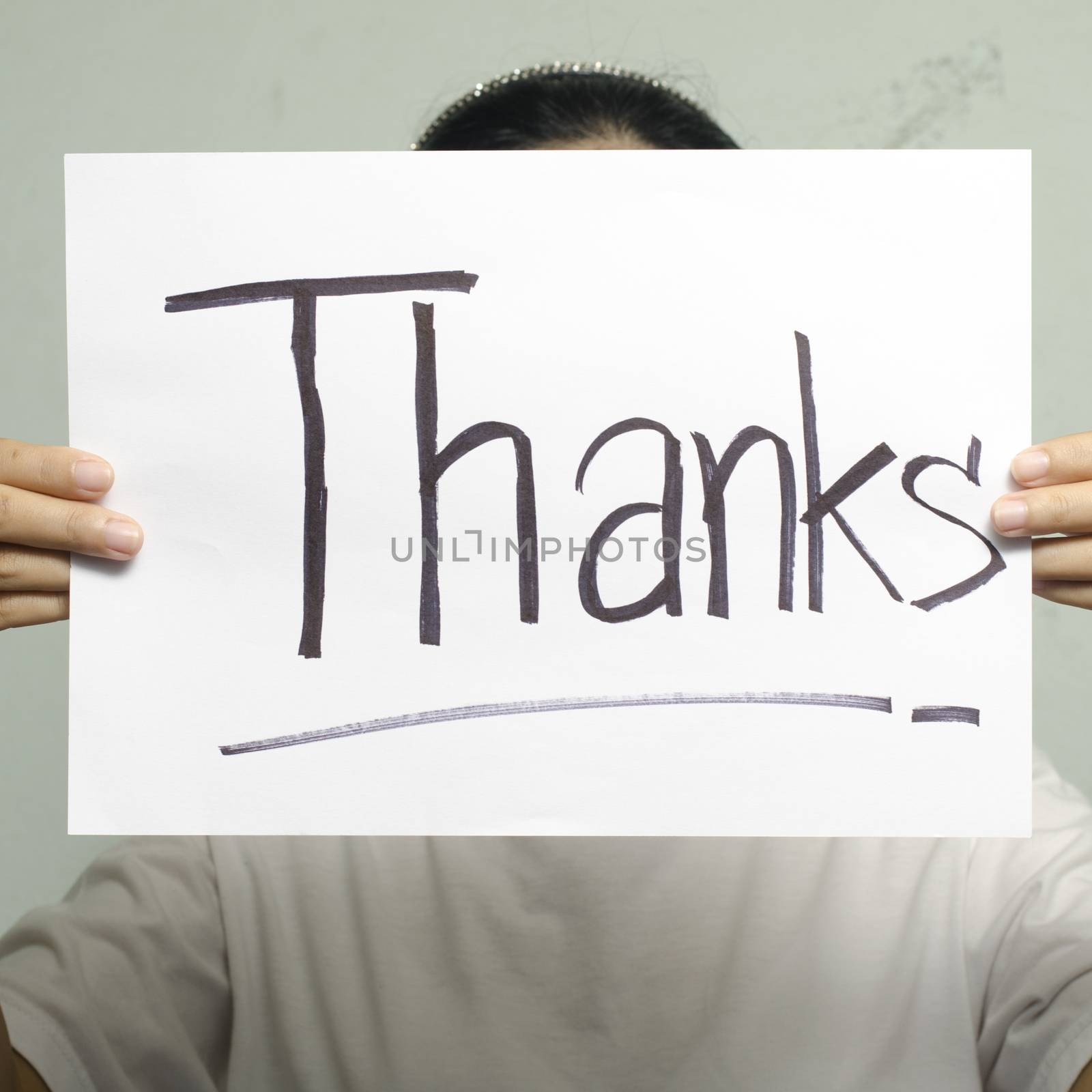 two woman hand holding paper write thanks word