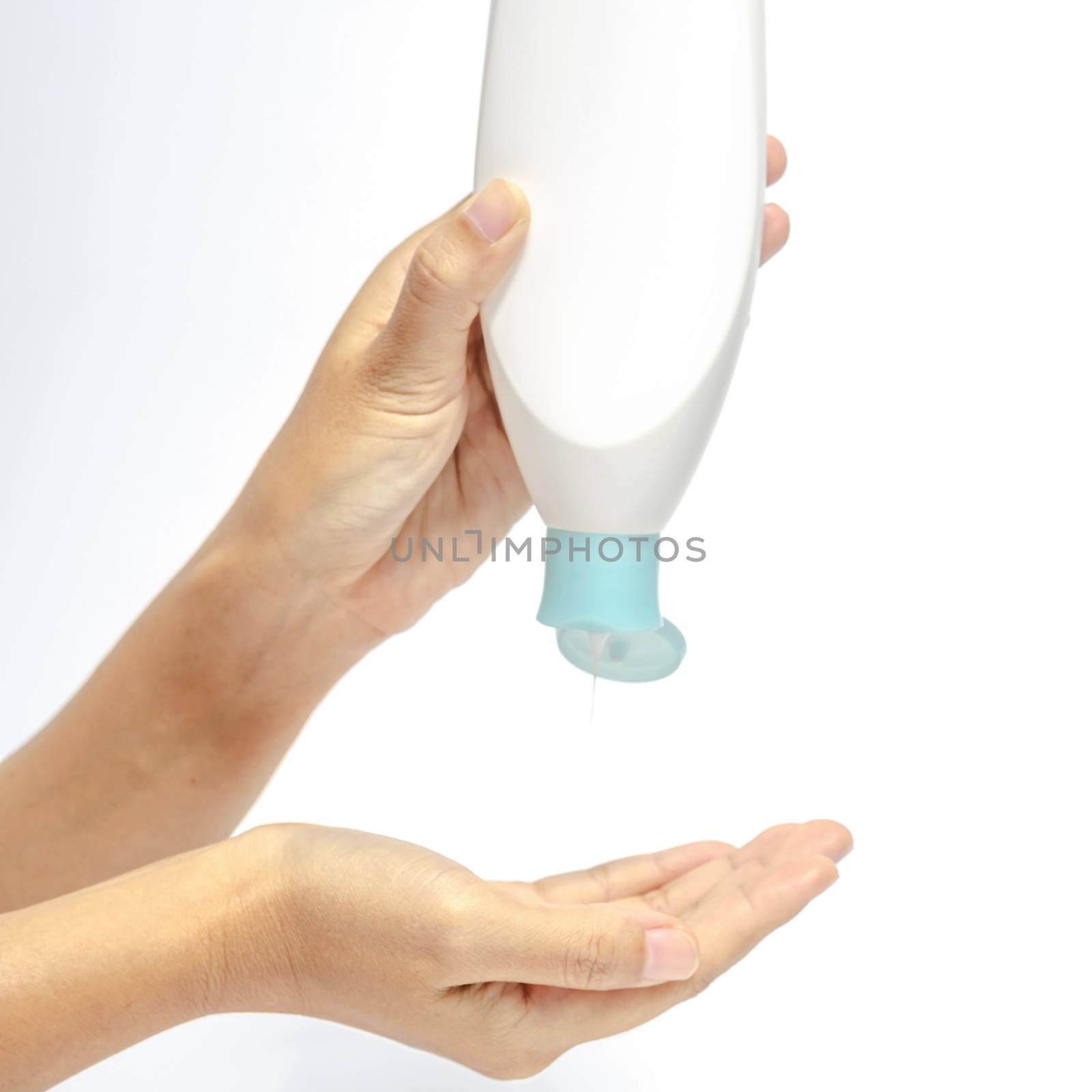 woman pouring body lotion on hand isolated on white background