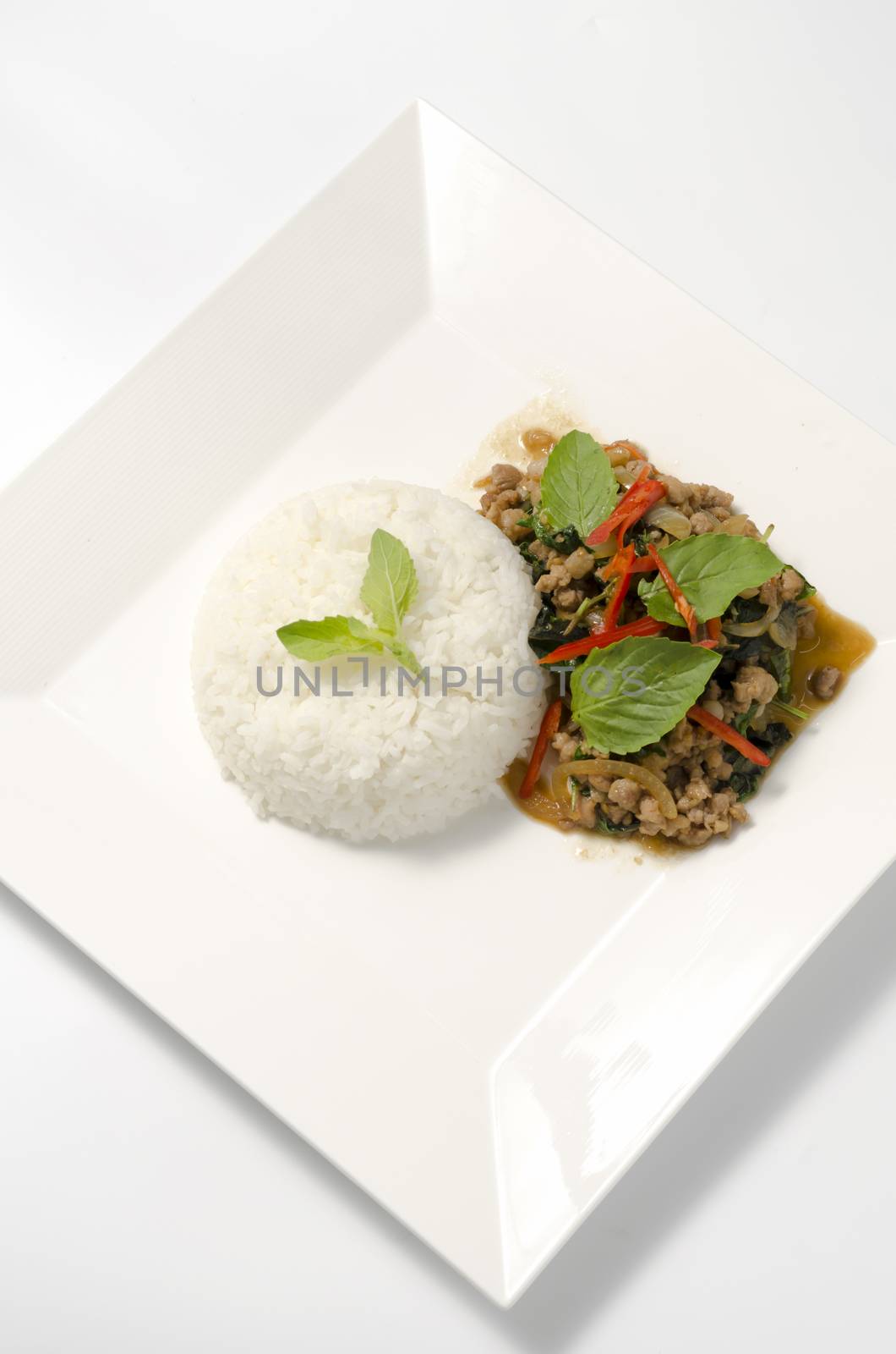 Rice topped with stir-fried pork and basil by ammza12