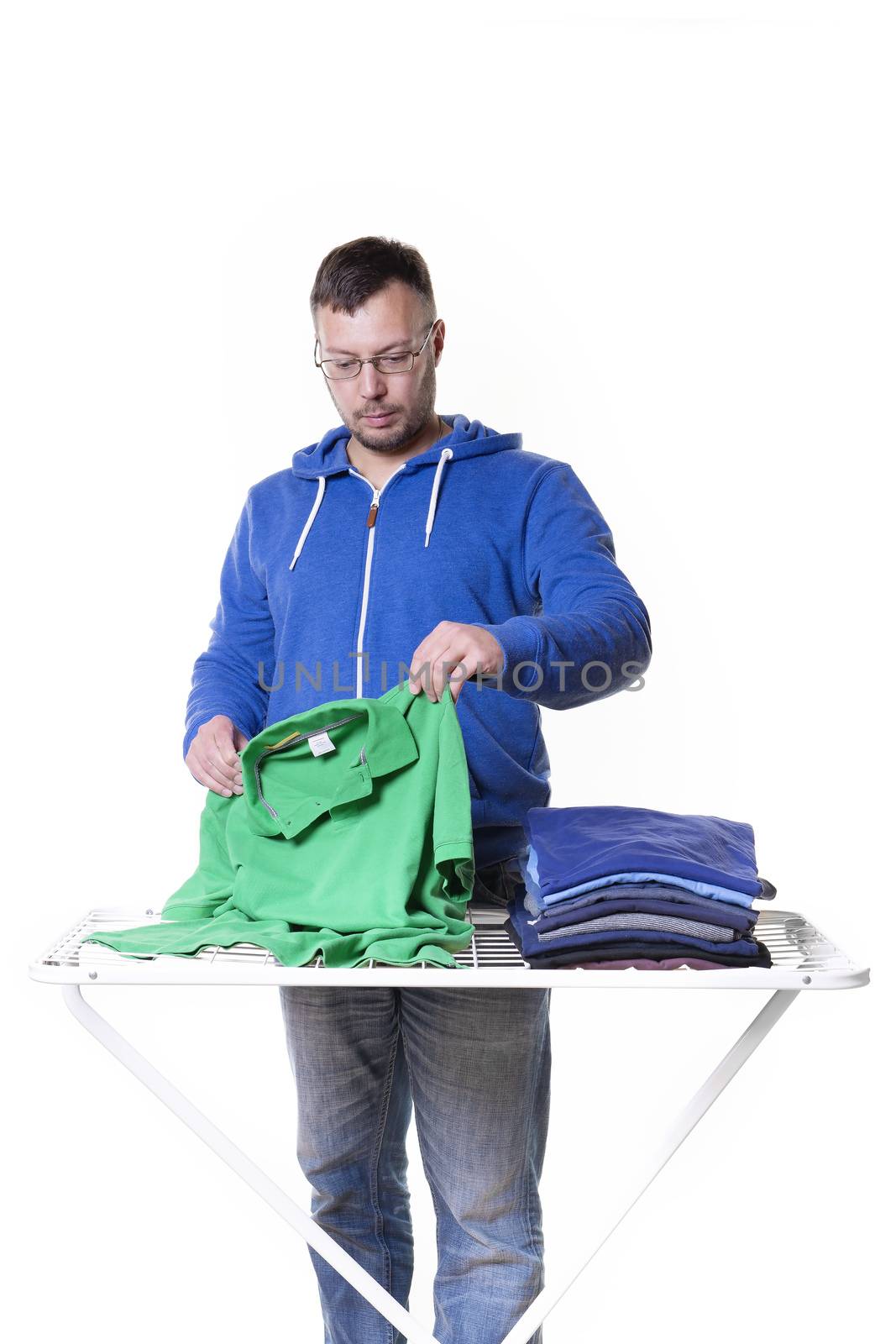 man doing housework and putting the laundry together