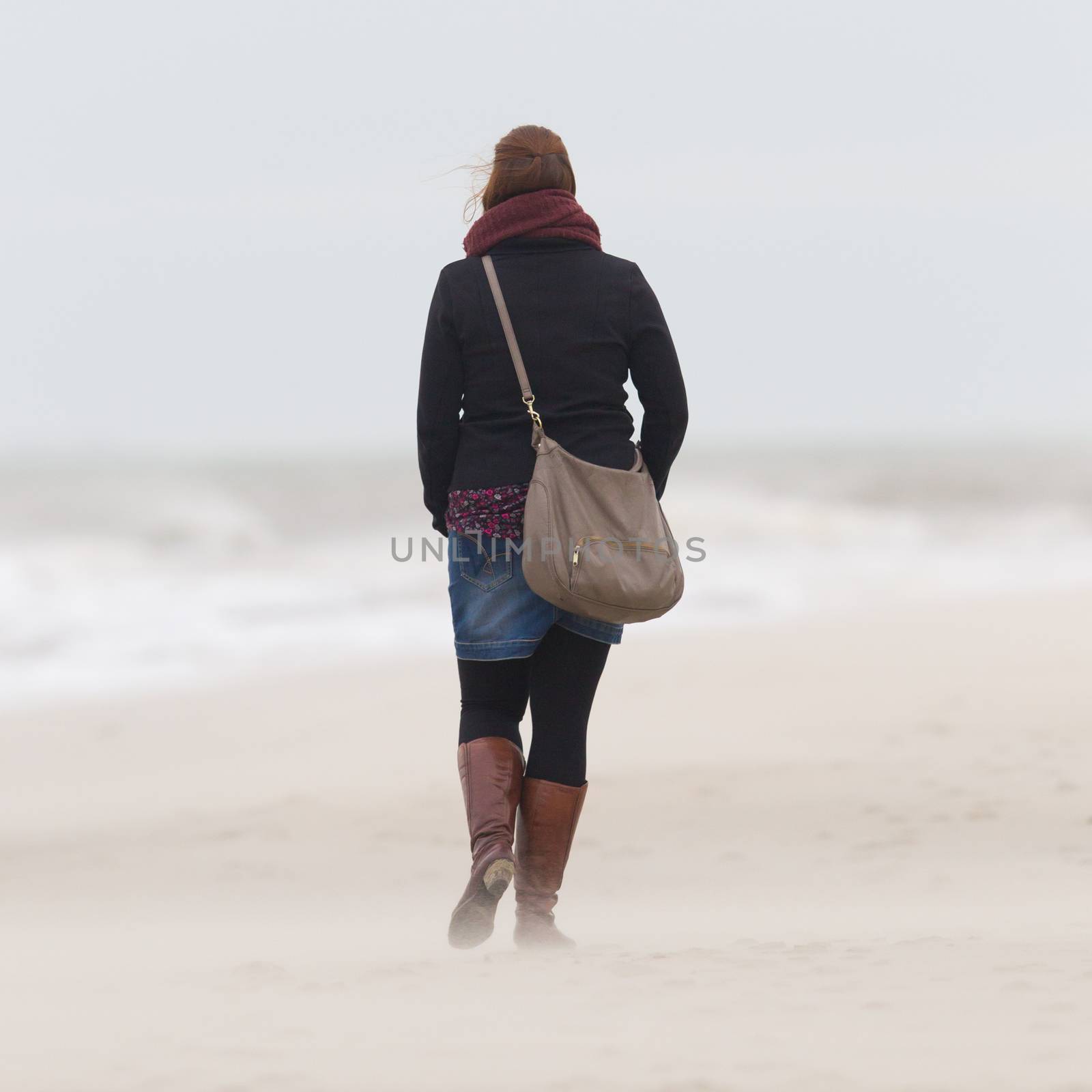 Woman on beach by michaklootwijk