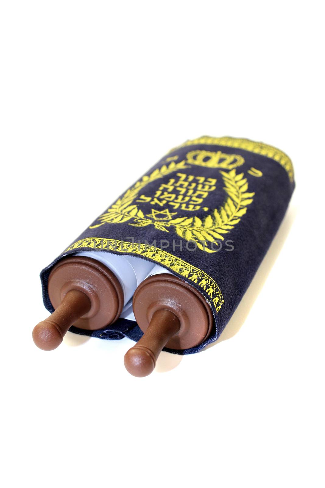 Torah scroll with cover on bright background
