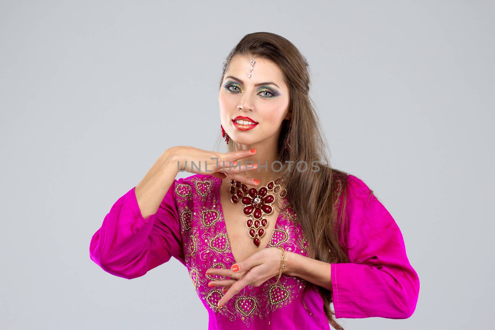 Pretty European woman posing in Indian Style