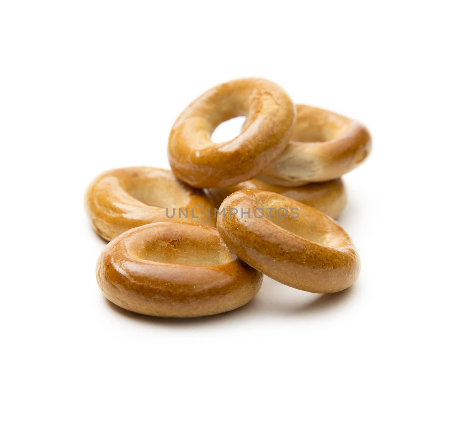 Small bread ring crackers on white by Garsya