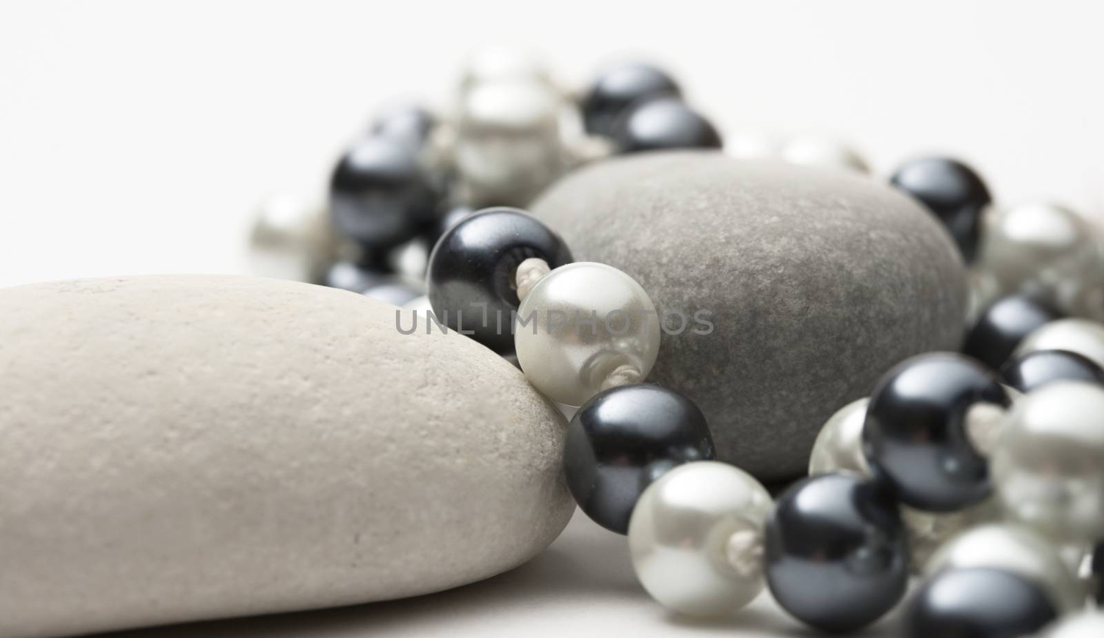 String of black and white pearls with stones