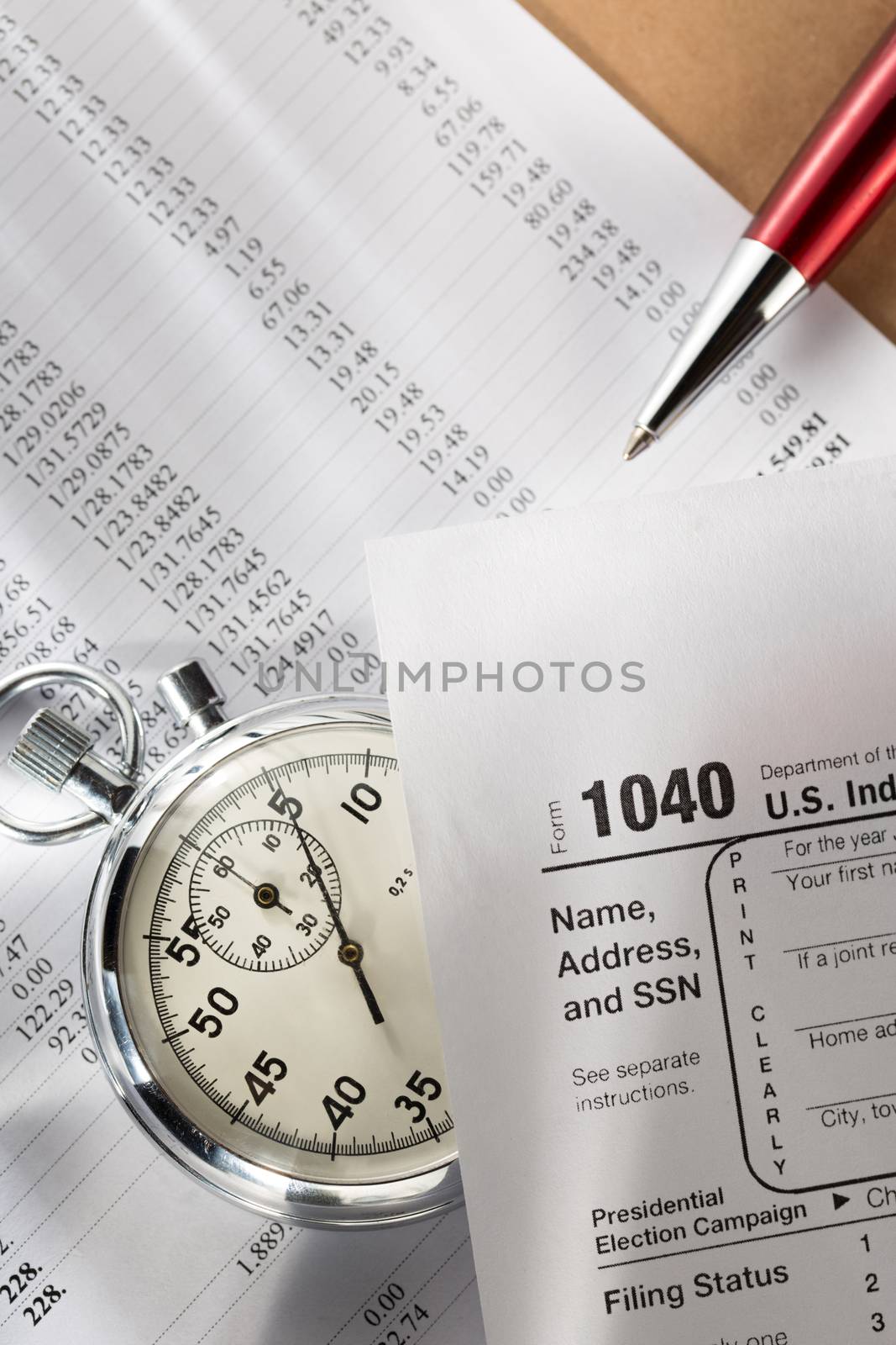 Tax form, operating budget and stopwatch