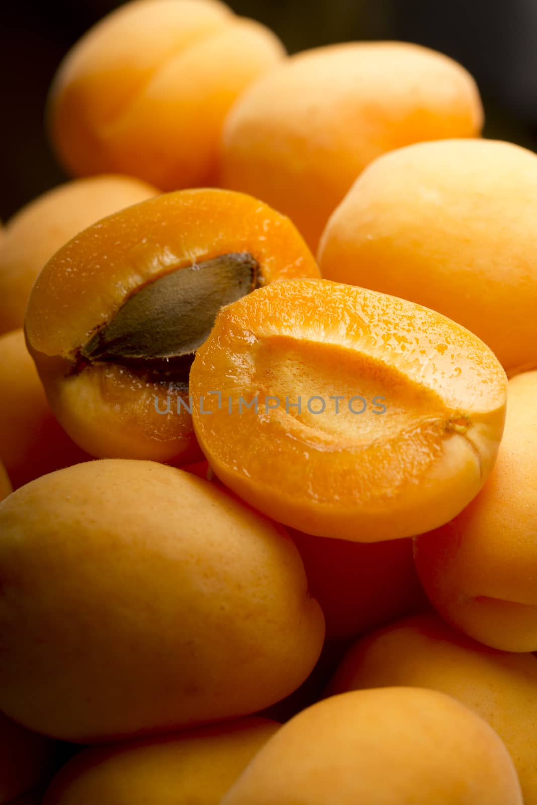 Heap of ripe apricots by Garsya