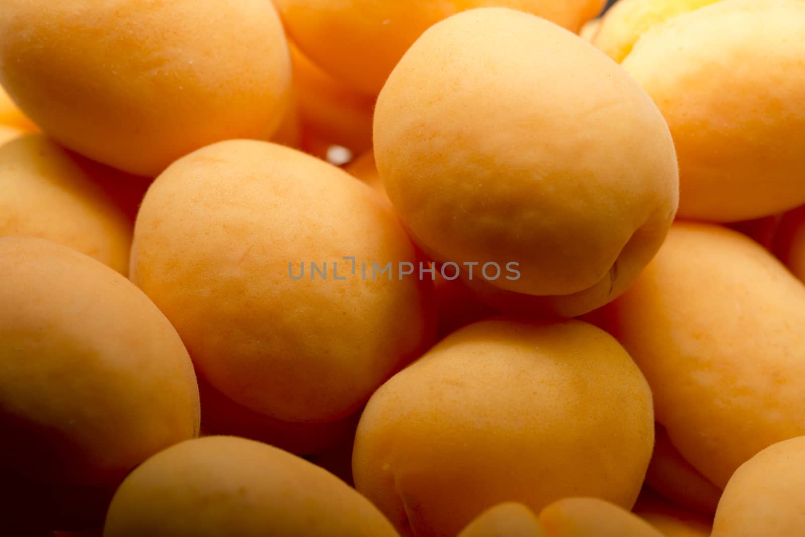 Heap of ripe apricots by Garsya