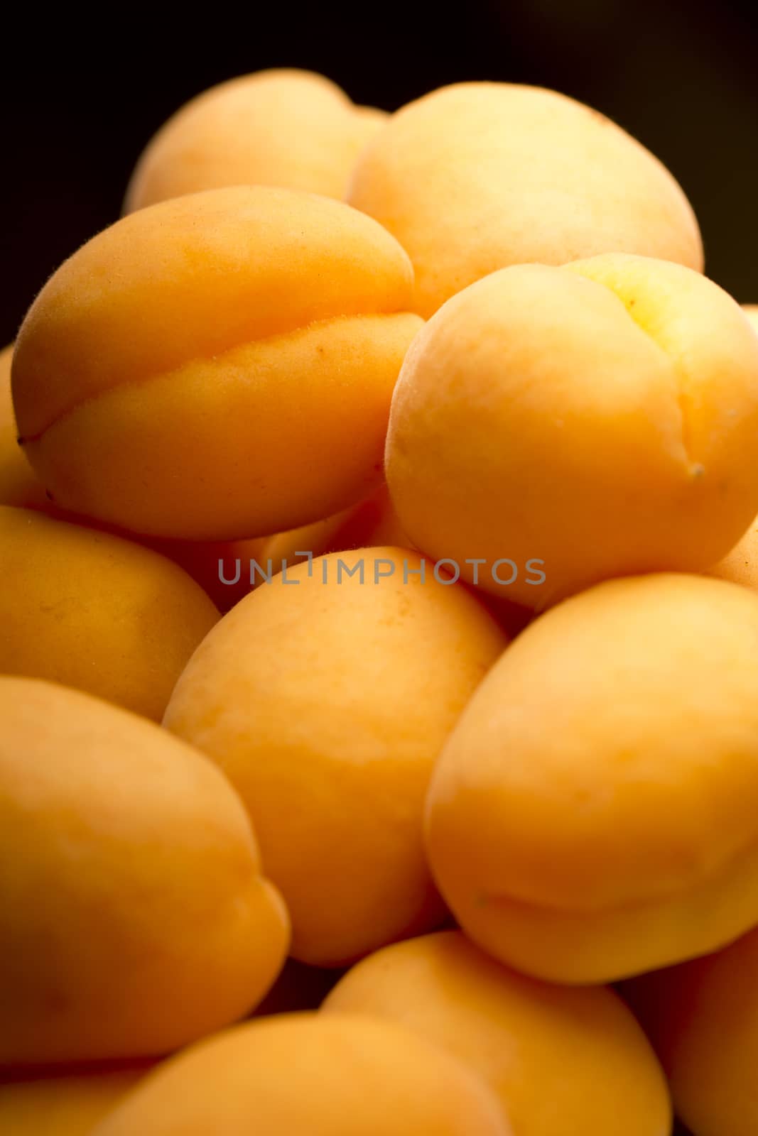 Heap of ripe apricots by Garsya