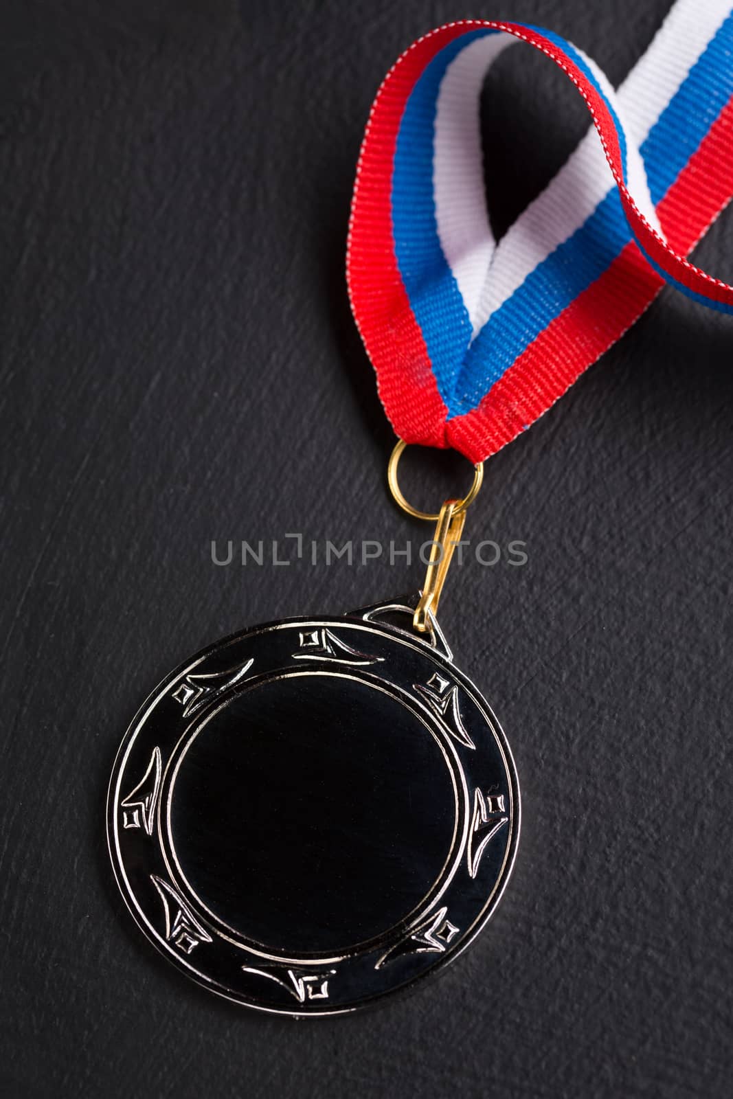 Metal medal with tricolor ribbon 