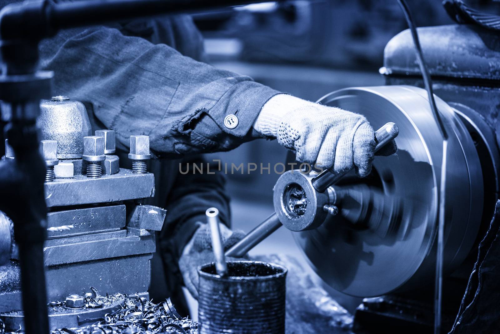 Turning lathe in the workshop in blue