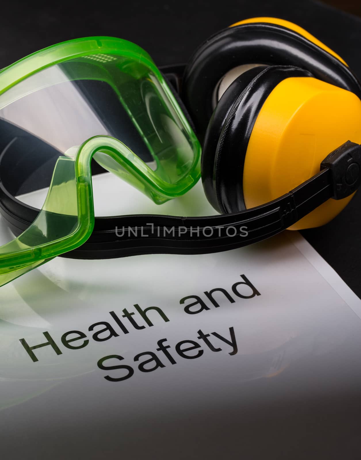 Health and safety register with goggles and earphones 