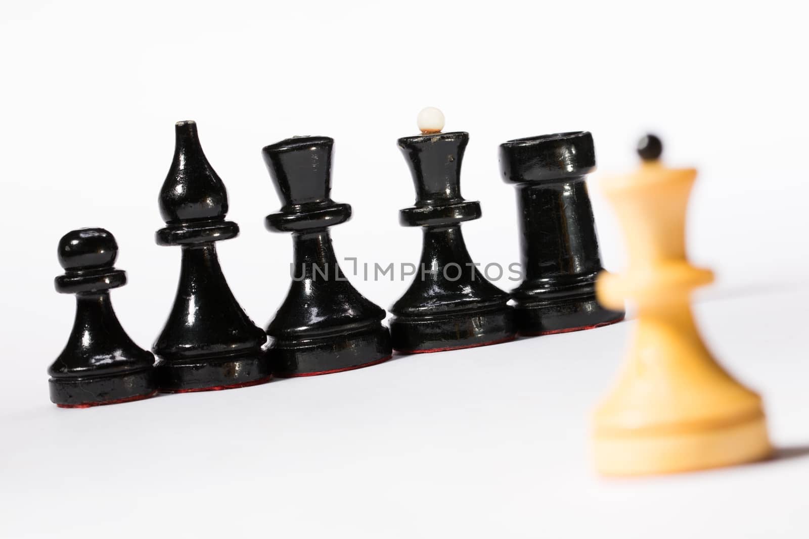 Black and white chessmen on white 
