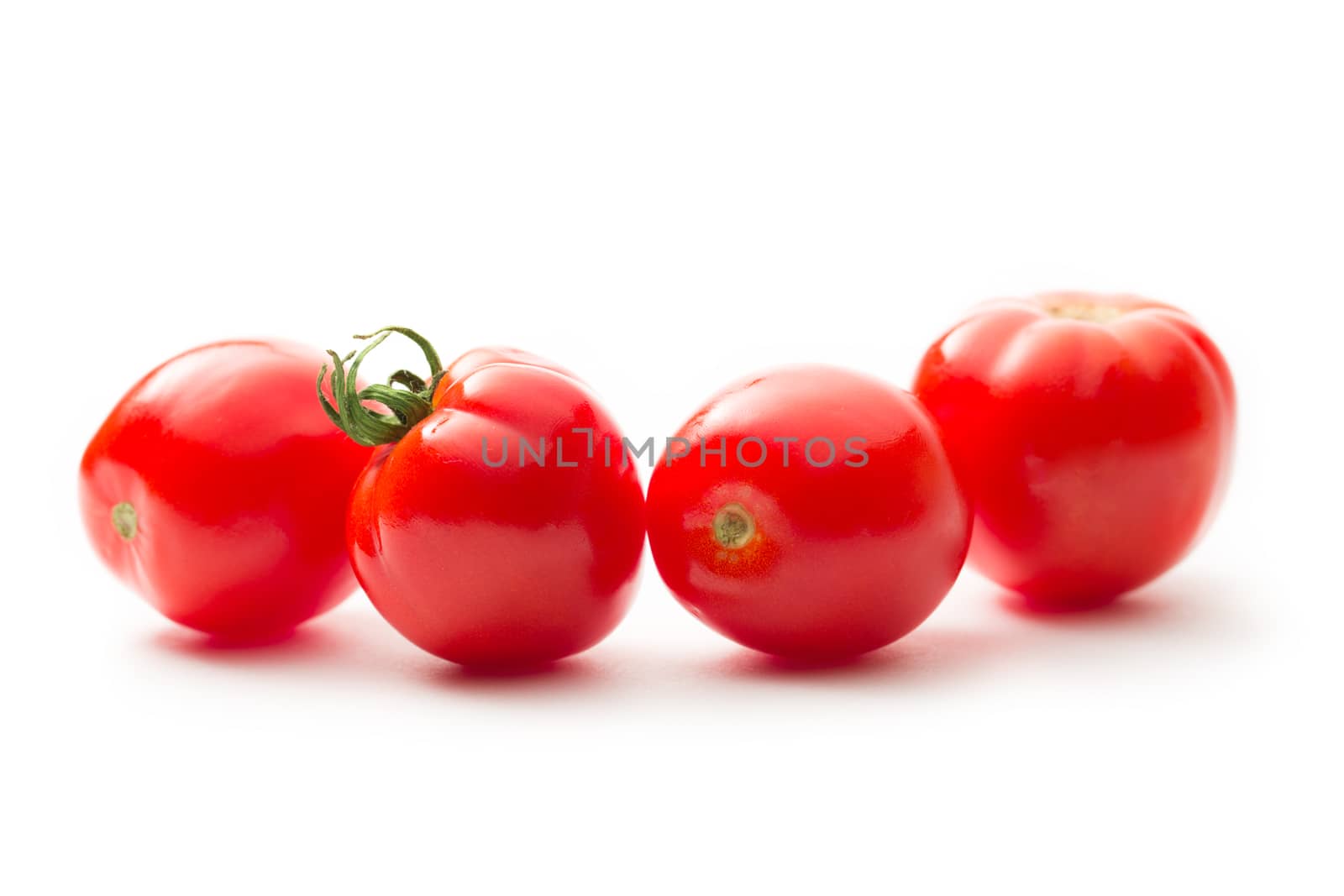 Fresh tomatoes on white