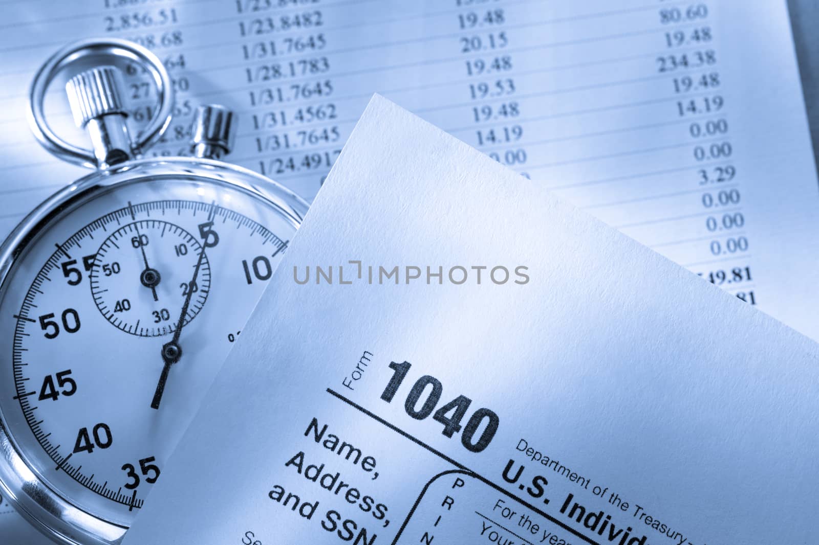 Tax form, operating budget and stopwatch