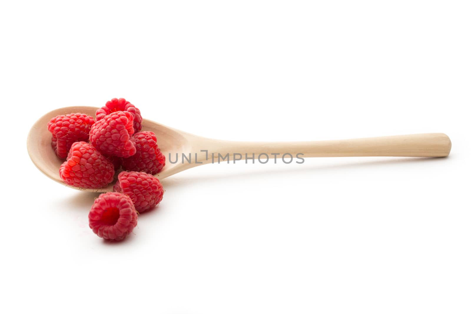 Fresh raspberry in wooden spoon by Garsya