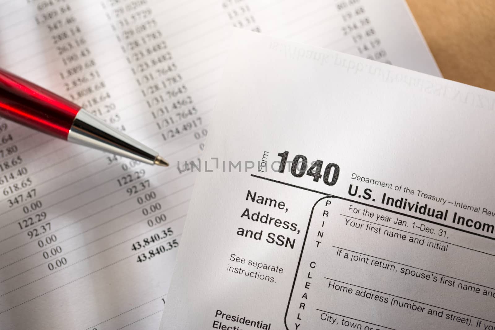 Tax form, operating budget and pen 