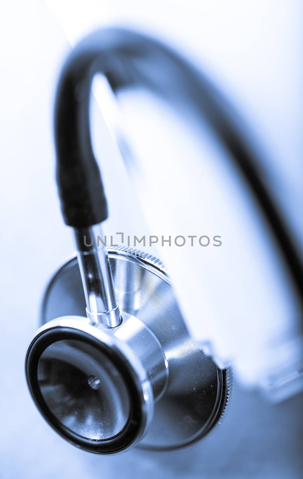 Stethoscope and heap of paper cards