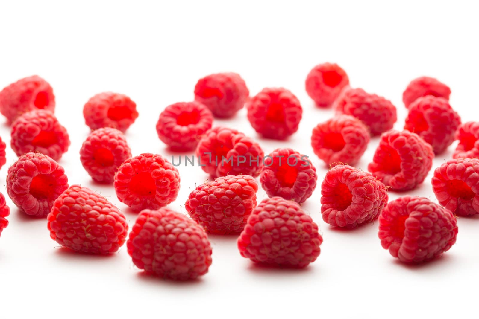 Fresh raspberry on white background