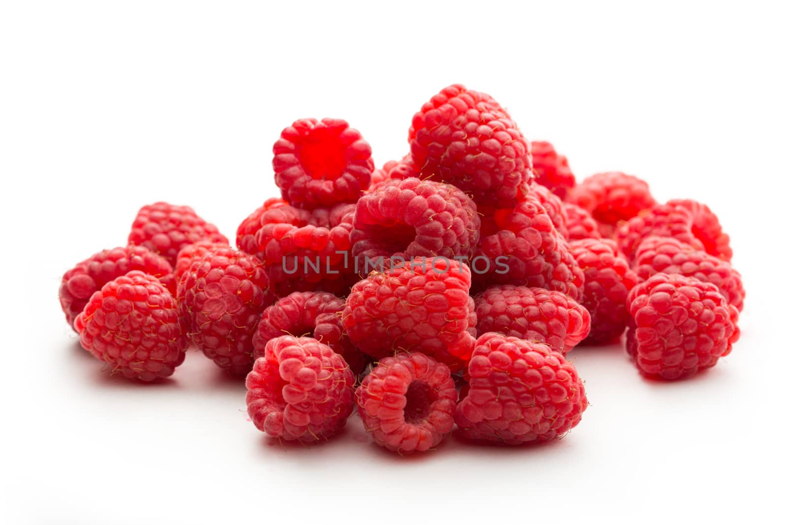Fresh raspberry on white background by Garsya