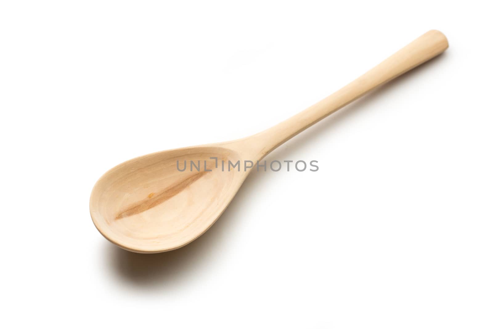 Wooden spoon on white background by Garsya