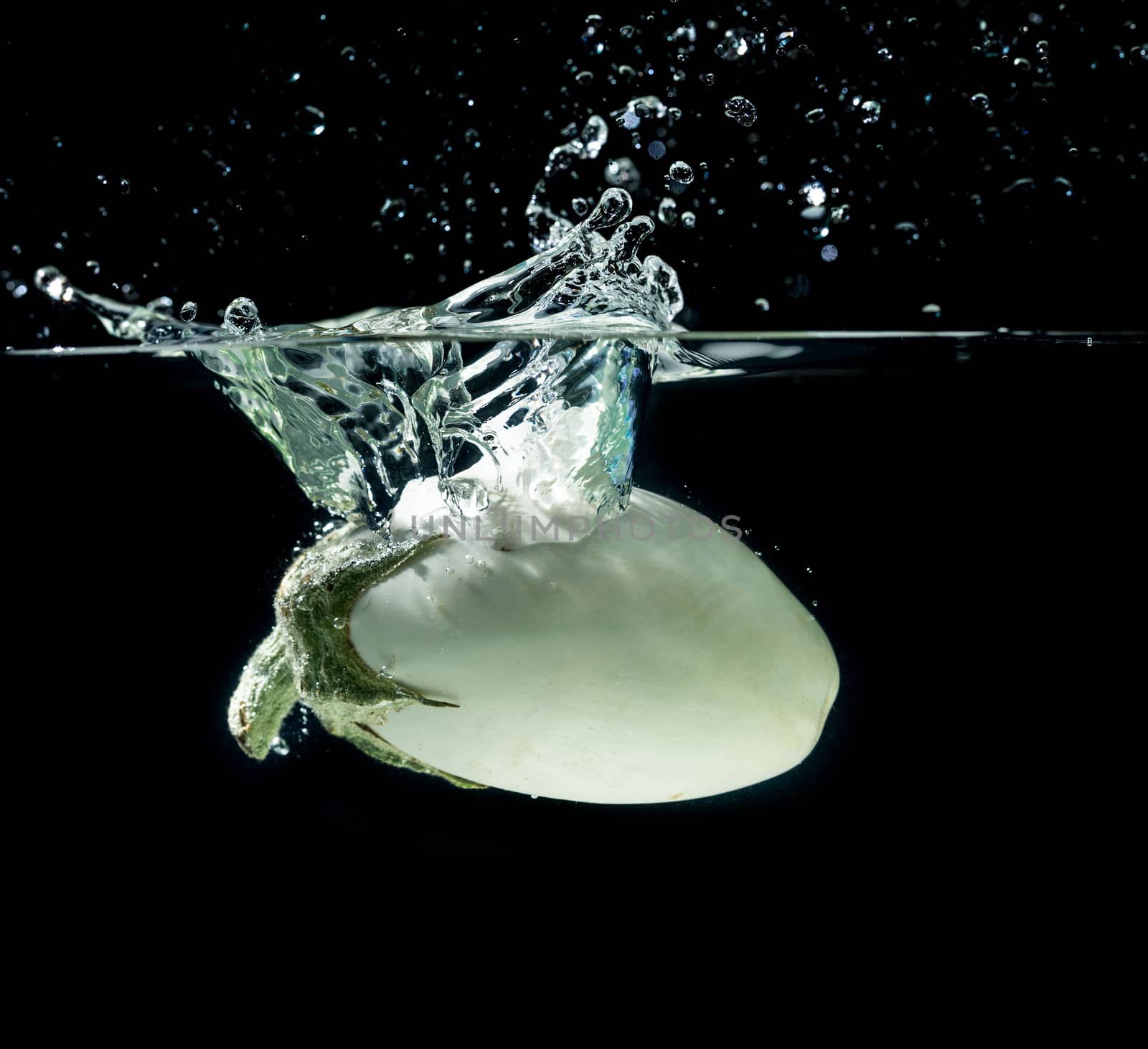 White aubergine in water splash by Garsya