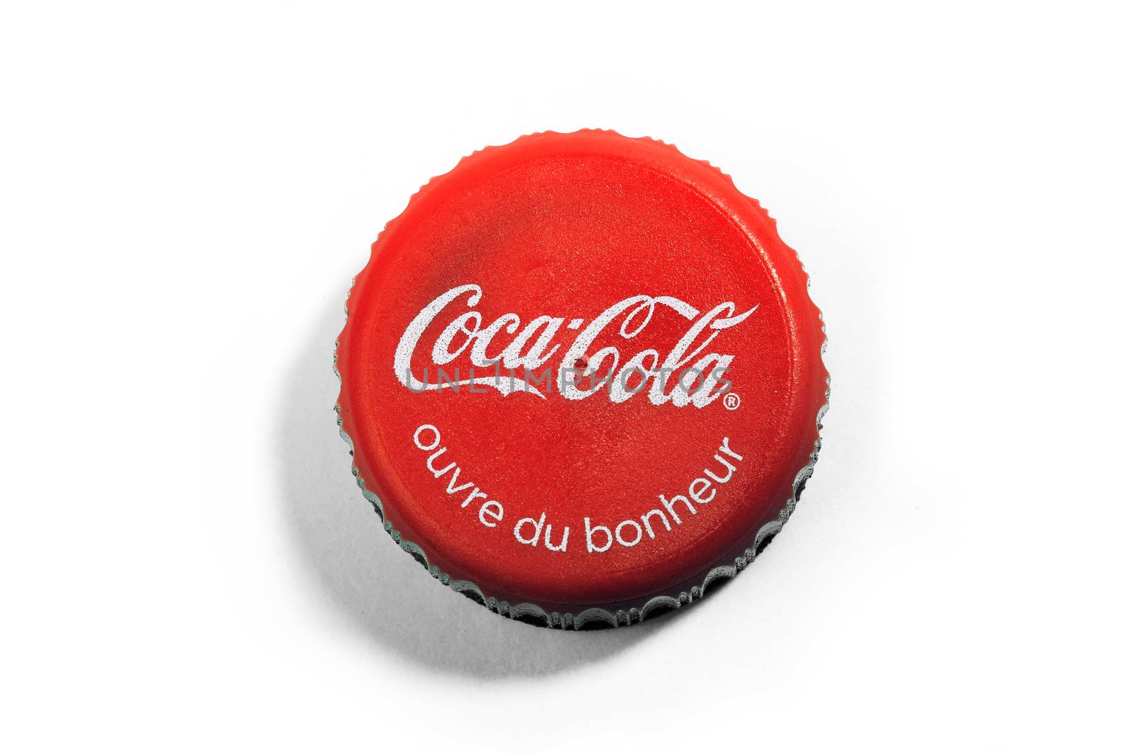 Bottle cap soda brand Coca-Cola and its slogan opens happiness