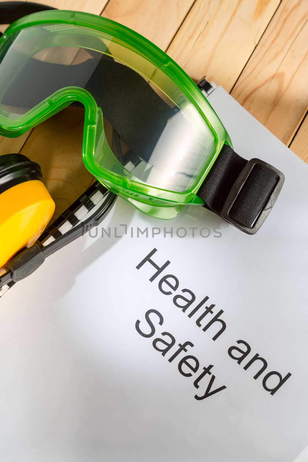 Register with goggles and earphones on wooden background