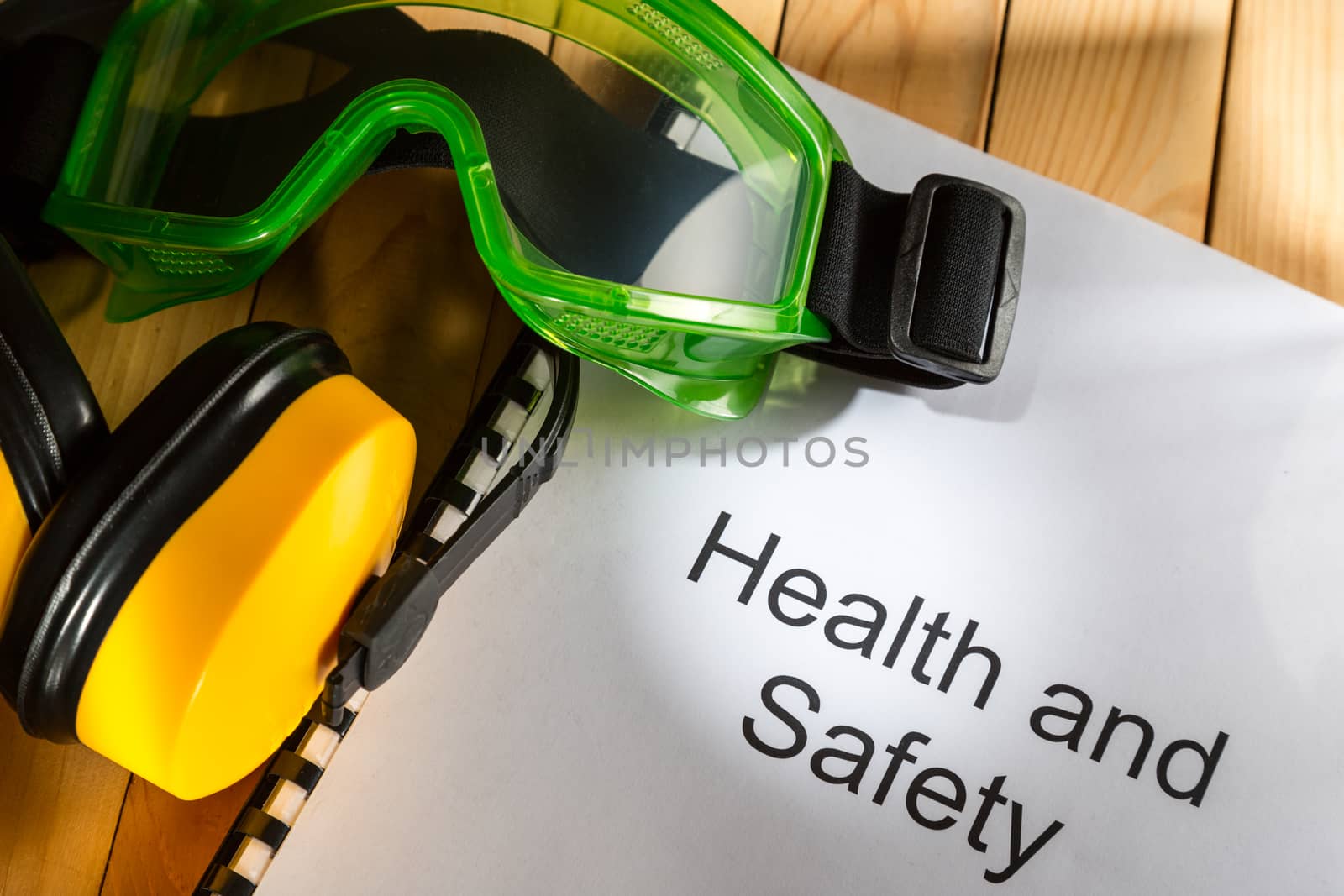 Register with goggles and earphones on wooden background