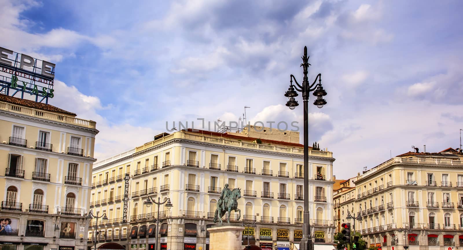 Puerta del Sol Gate of the Sun Most Famous Square King Carlos III Equestrian Statue in Madrid Spain King of Spain in the 1700s.  Replica of statue created in 1700s by Juan Pascal de de Mena