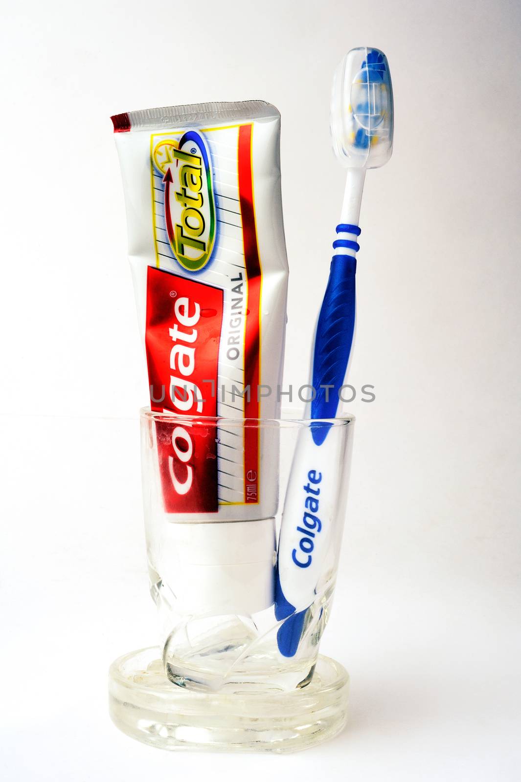 Set of Colgate toothpaste with toothbrush on white background