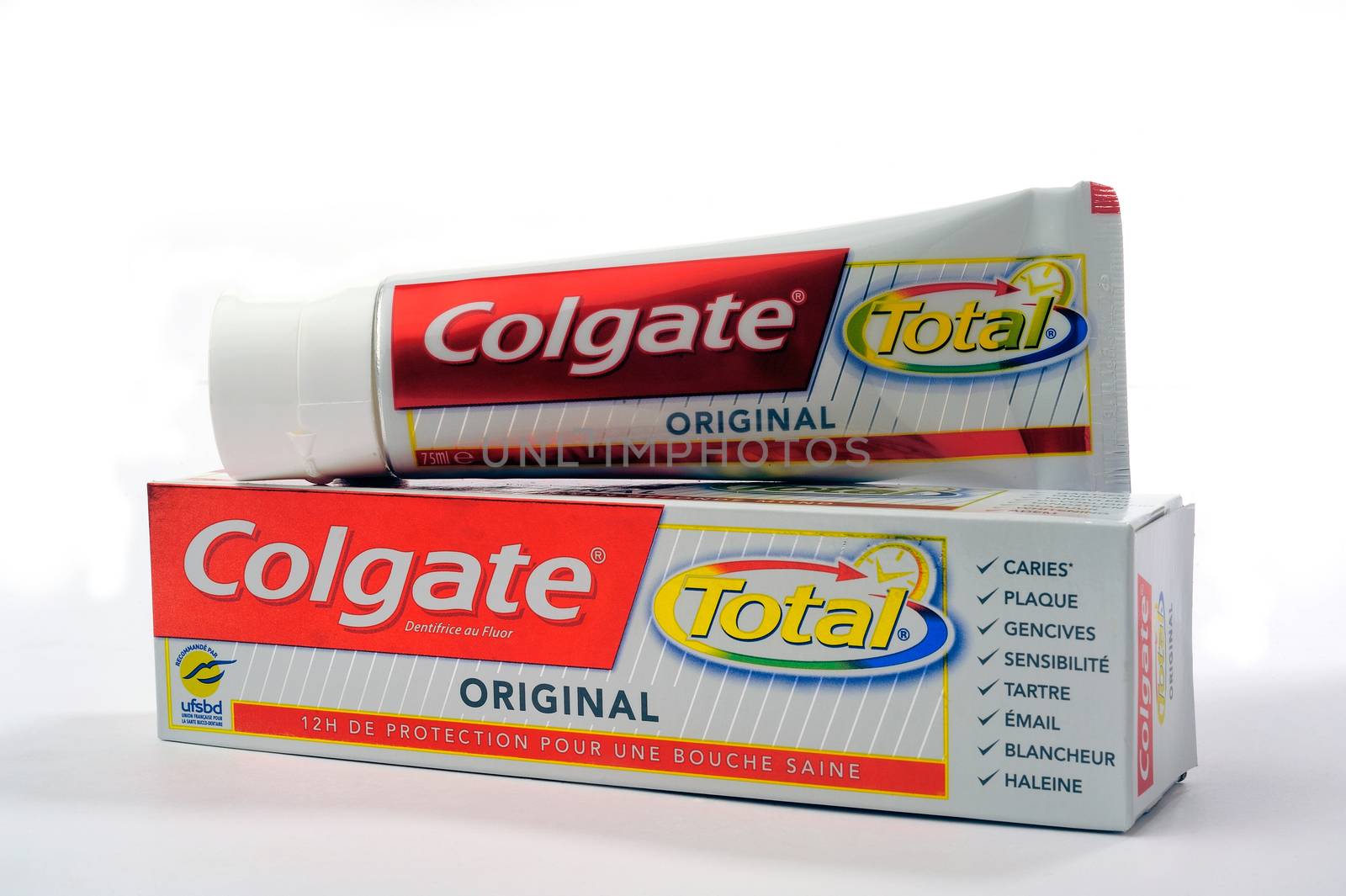 Set of Colgate toothpaste with toothbrush on white background