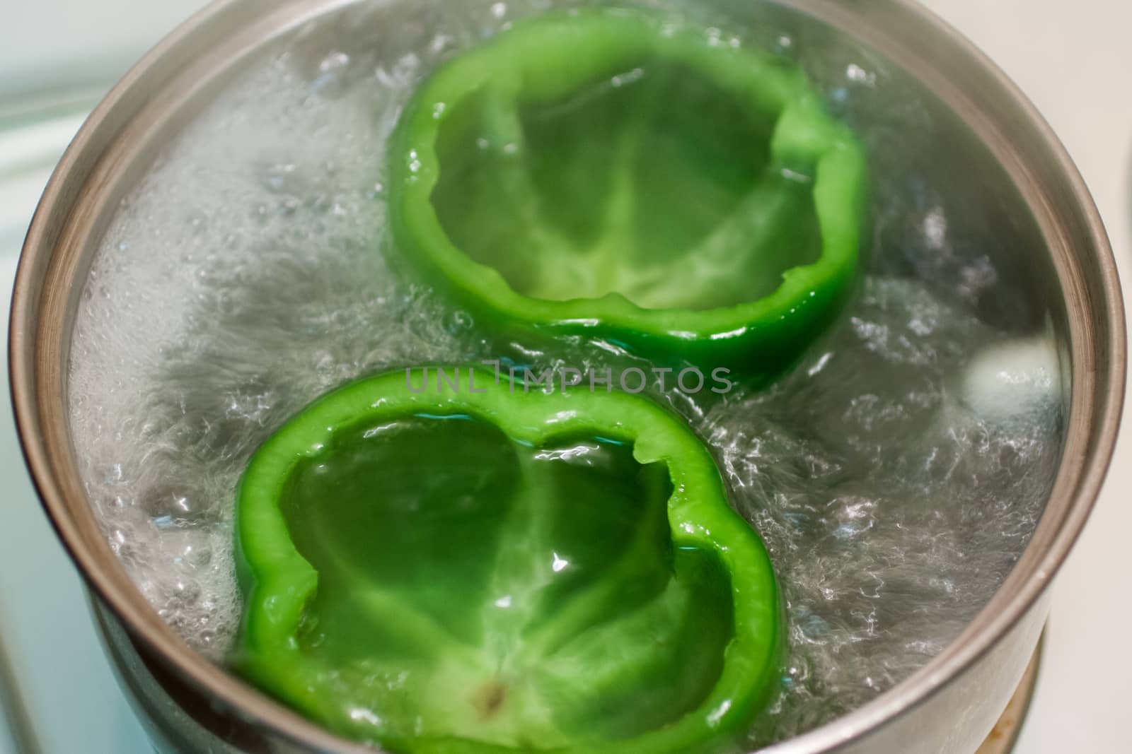 Green bell peppers cut and cleaned for stuffed peppers.