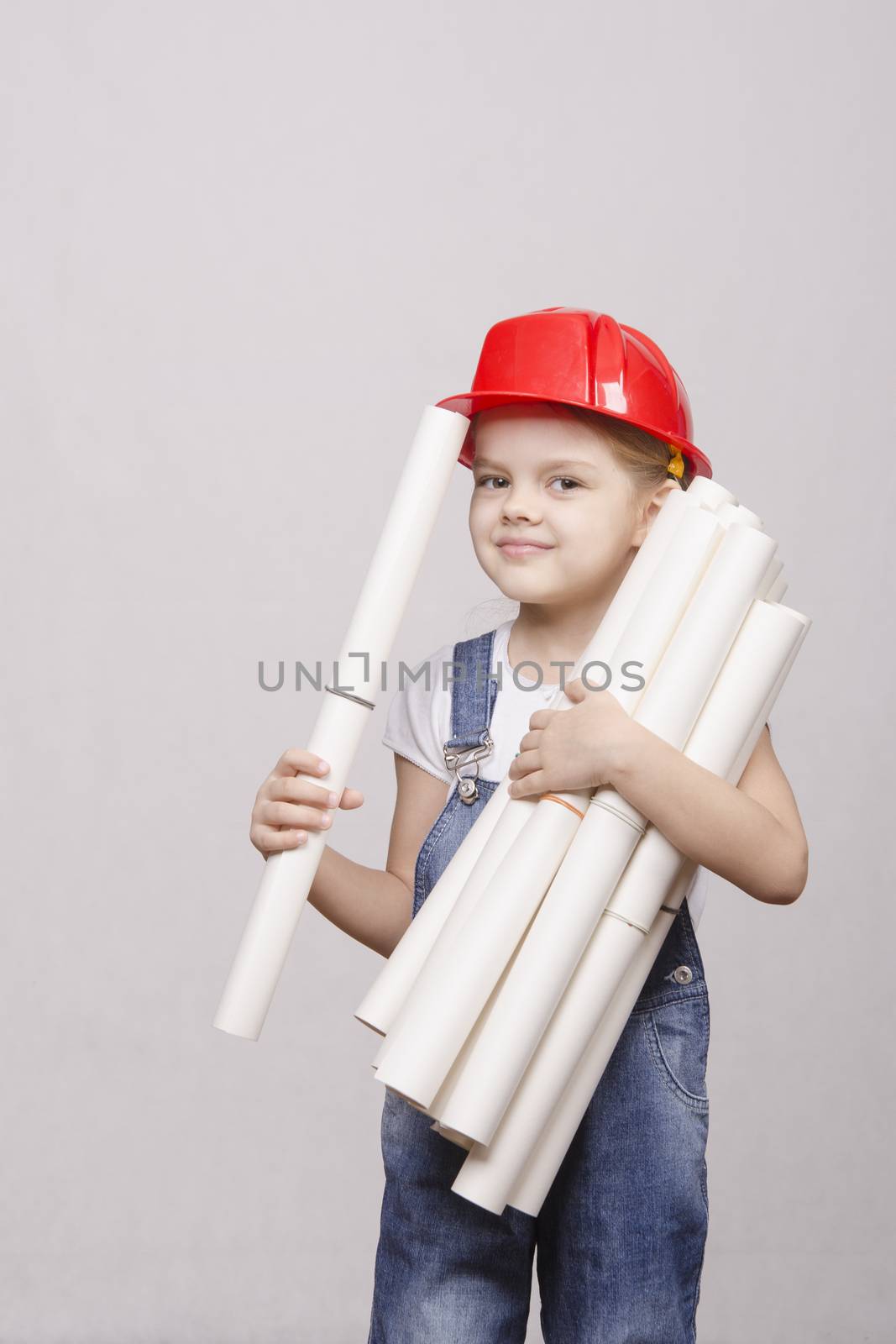Girl Builder keeps a bunch of drawings and smiles