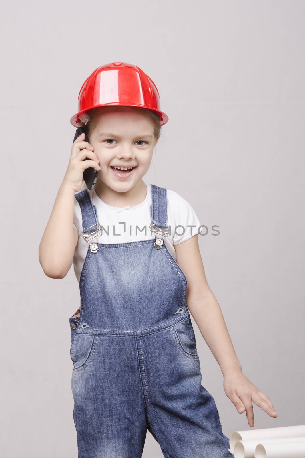 Girl playing Builder talking on the phone