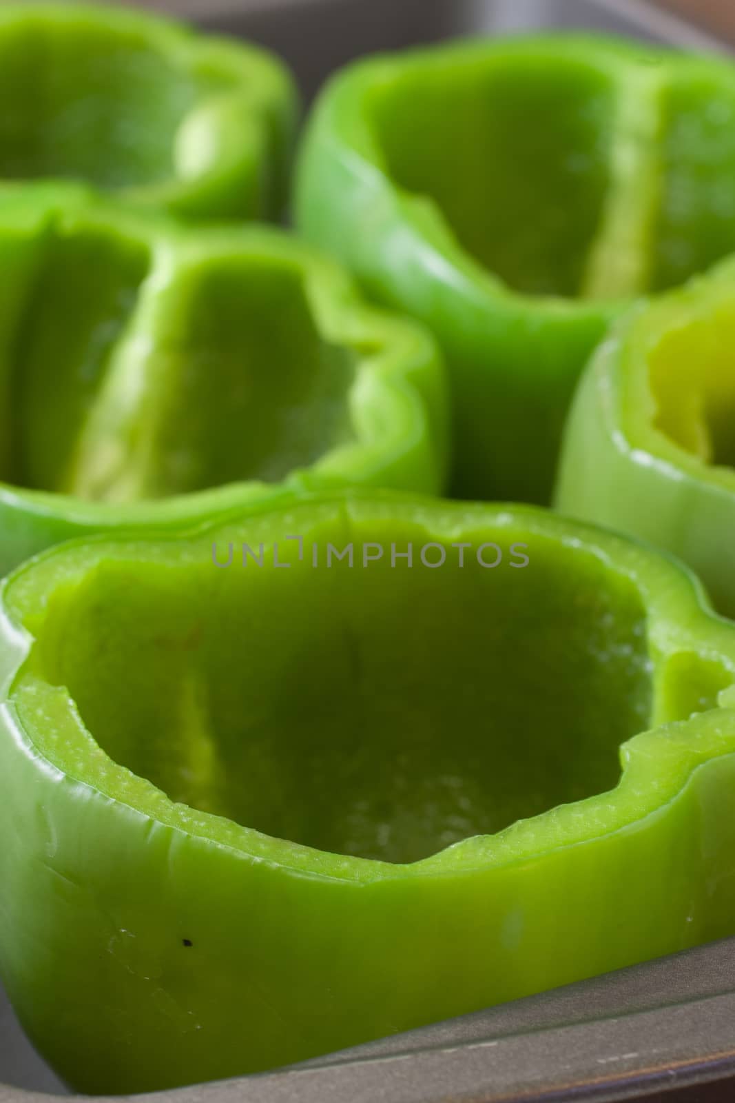 Green bell peppers cut and cleaned for stuffed peppers.