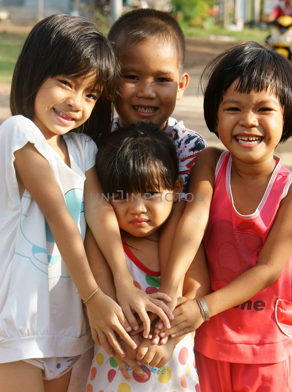 MEKONG DELTA, VIET NAM- SEPT 20: Group of unidentified Asian children have fun at Vietnamese country in sunny day, pretty, lovely face with innocent smile of Mekong Delta kid, Vietnam, Sept 20, 2014