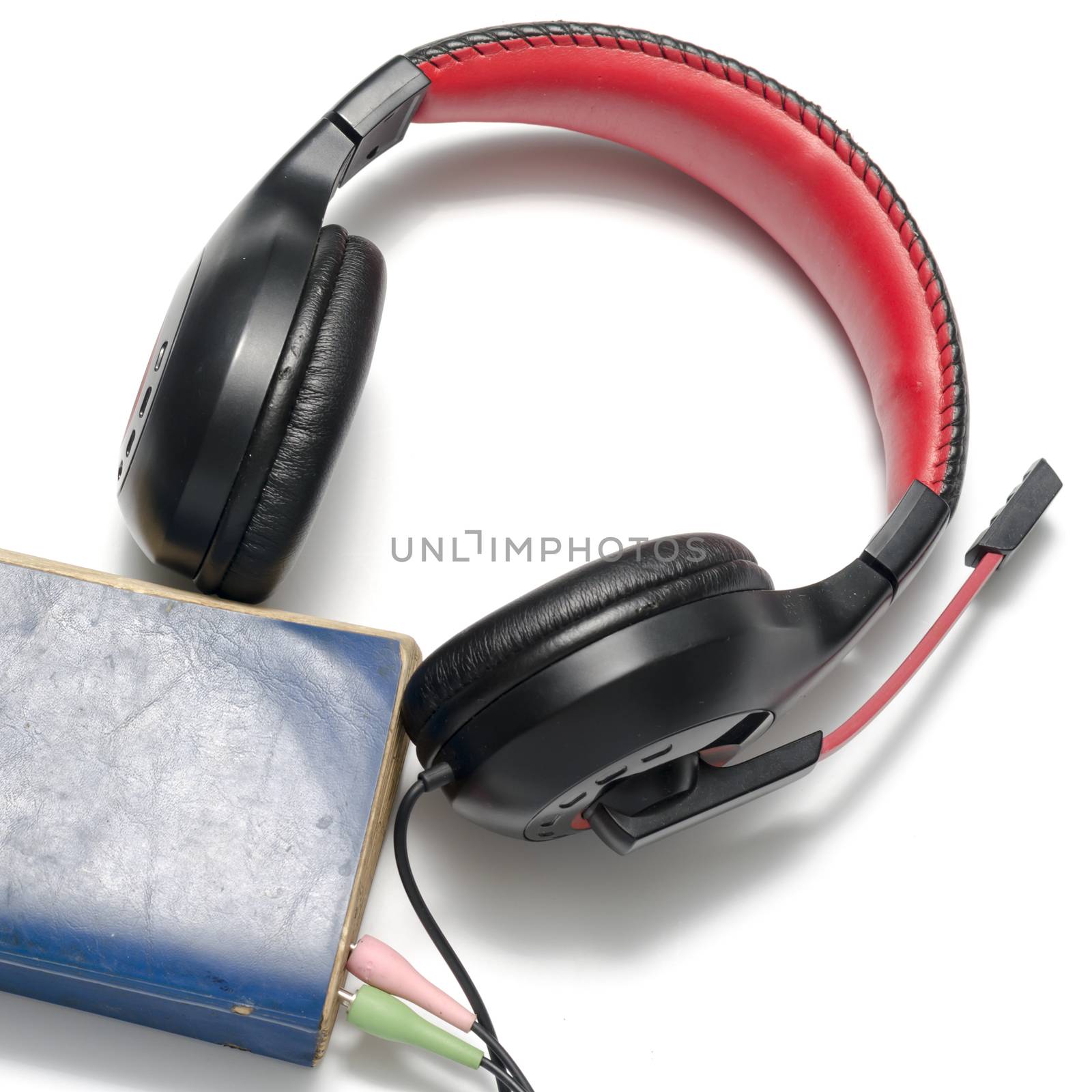 head phone with book concept audio book on a white background
