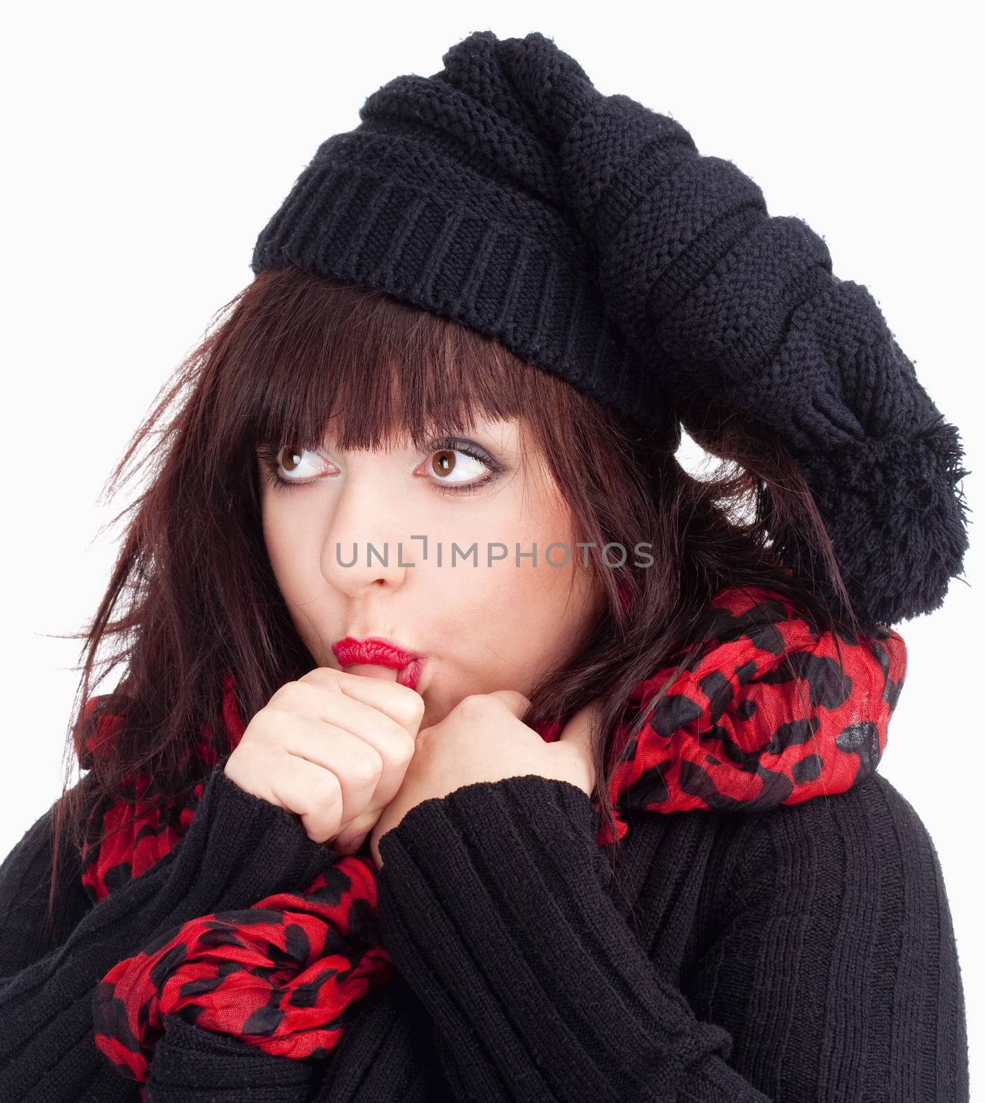 Young Woman with Black Cap Sucking on her Thumb - Isolated on White