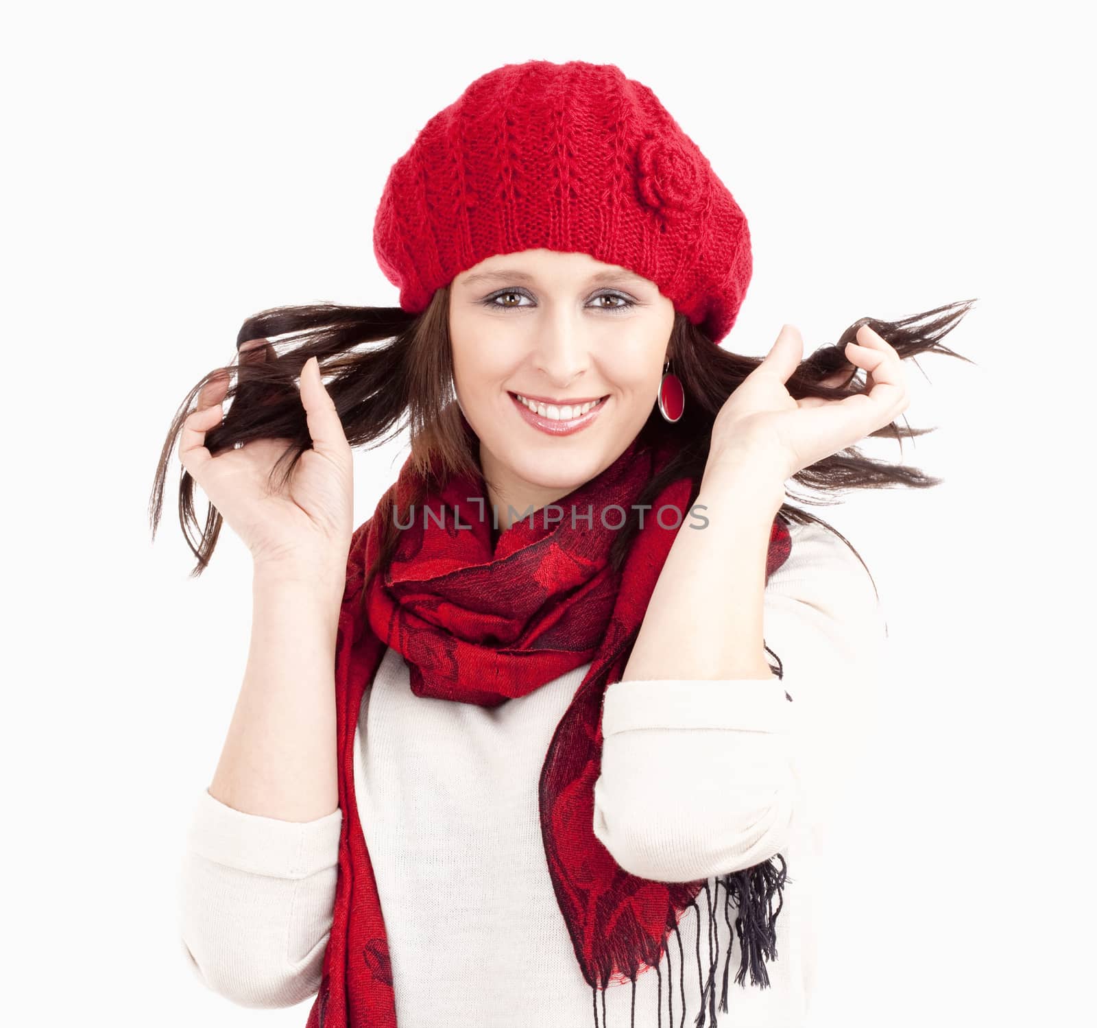 Young Woman in Red Cap and Scarf Smiling by courtyardpix